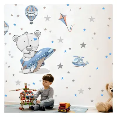 Sticker mural garçon - Ours en peluche avec un avion bleu